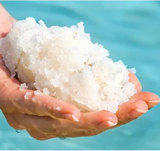 Unrefined sea minerals held in two hands